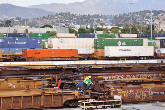 A person works at a Union Pacific Intermodal Terminal rail yard