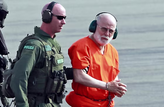 Whitey Bulger is taken from a Coast Guard helicopter to an awaiting Sherif vehicle after attending federal court in Boston, on June 30, 2011. 