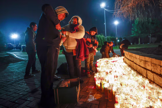 Image: Worshippers light candles at an altar of Our Lady of Guadalupe in Des Plaines, Ill., on Dec. 11, 2022. 
