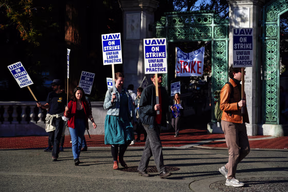 Image: Graduate student instructors and researchers picket at University of California, Berkeley's Sather Gate during the fourth week of a strike by academic workers at the 10-campus UC system in Berkeley, Calif., on Dec. 7, 2022. 