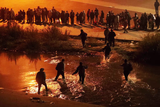 Migrants cross the Rio Grande river in Ciudad Juarez, Mexico, on Dec. 11, 2022. 