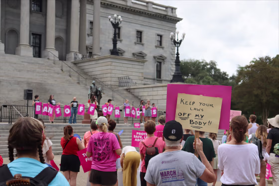 Protesters gather outside the state house in opposition to a proposed abortion ban, in Columbia, S.C.