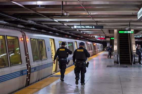 Police officers inside the Bay Area Transit (BART) Embarcadero station in San Francisco on Oct. 10, 2022.