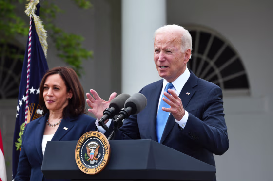 US Vice President Kamala Harris looks on as US President Joe Biden delivers remarks on Covid-19 response and the vaccination program, from the Rose Garden of the White House, Washington, DC on May 13, 2021.