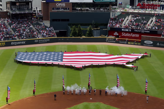 The American Flag displayed prior to a game between the Miami Marlins and the Atlanta Braves in Atlanta