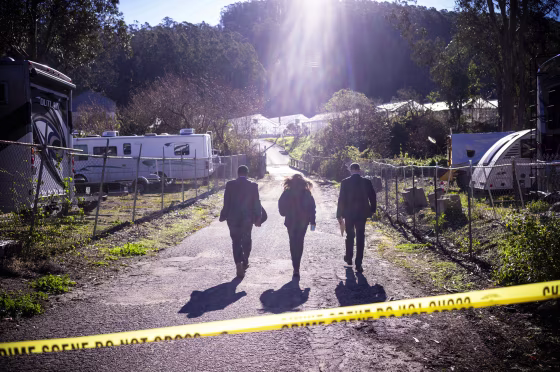 FBI officials walk towards the crime scene at Mountain Mushroom Farm on Jan. 24, 2023.