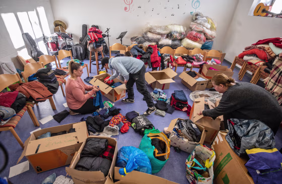 Workers sort clothes for aid shipments to Turkey and Syria in Stuttgart, Germany, on Feb. 7, 2023.