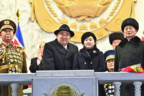 North Korea's leader Kim Jong Un and his daughter presumed to be named Ju Ae, attending a military parade in Pyongyang in images released Thursday. 