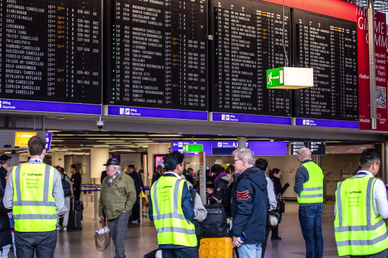Image: Lufthansa's employees help customers after their flights have been canceled, at the Frankfurt airport in Frankfurt am Main, Germany, on Feb. 15, 2023.