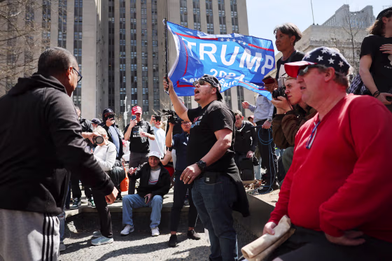 Supporters and opponents of former President Donald Trump gather outside of the Manhattan Criminal Court during his arraignment on April 04, 2023 in New York City. Trump will be arraigned during his first court appearance today following an indictment by a grand jury that heard evidence about money paid to adult film star Stormy Daniels before the 2016 presidential election. With the indictment, Trump becomes the first former U.S. president in history to be charged with a criminal offense.