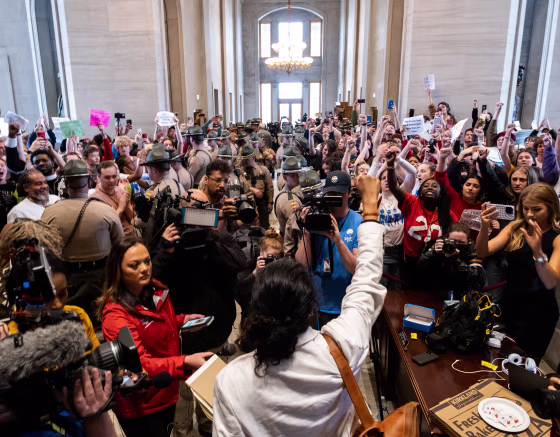 Former Rep. Justin Jones raises a fist to supporters during a vote on his expulsion at the Tennessee State Capitol