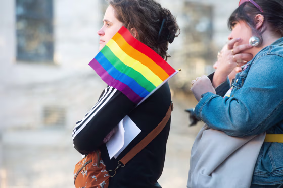Demonstrators listen while LGBT activist Shannon Brown speaks as hundreds gathered in Downtown Knoxville in protest of the Tennessee drag bill on Monday, Feb. 13, 2023.