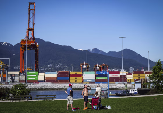 Image: A man drinks a beer at Crab Park in Vancouver, British Columbia on May 13, 2023.
