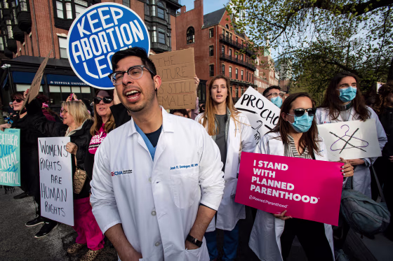 A group of doctors and medical workers join protesters gathering in front of the State House to show support and rally for abortion rights in Boston on May 3, 2022. 
