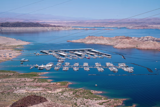 Boats docked along the shores of the Colorado River forming Lake Mead April 15, 2023 in Boulder City, Nev.