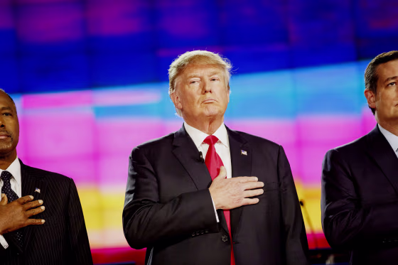 Donald Trump stands between Republican presidential candidates Ben Carson, left, and Senator Ted Cruz, on stage at the Republican presidential candidate debate in Las Vegas, Nev. in 2015.