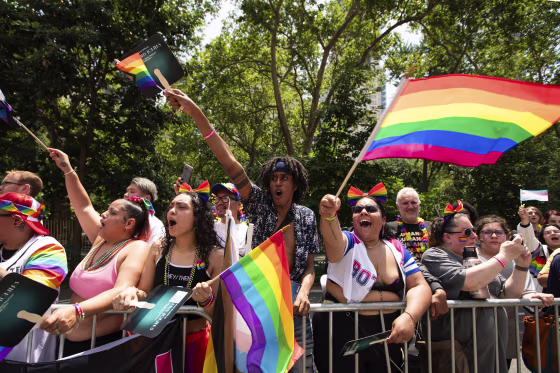 People watch the Pride parade in New York on June 25, 2023.