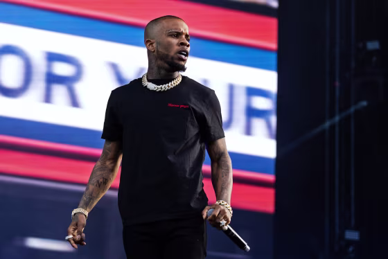 Tory Lanez looks out to the crowd while performing onstage