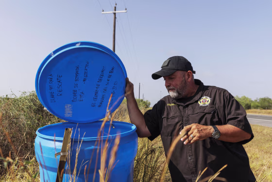 Ruben Garza inspects a water station for immigrants
