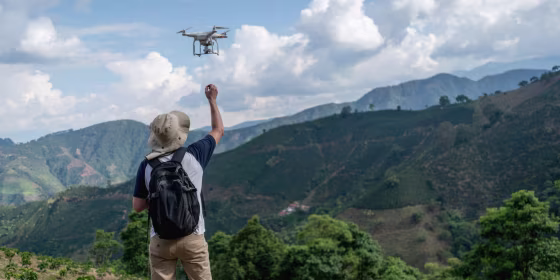 You can take aerial photos and videos of landscapes with a drone.