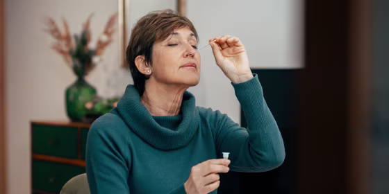 Woman using a Covid test on herself