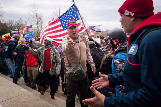 Ray Epps, in the red Trump hat, center, at the Capitol on Jan. 6, 2021.