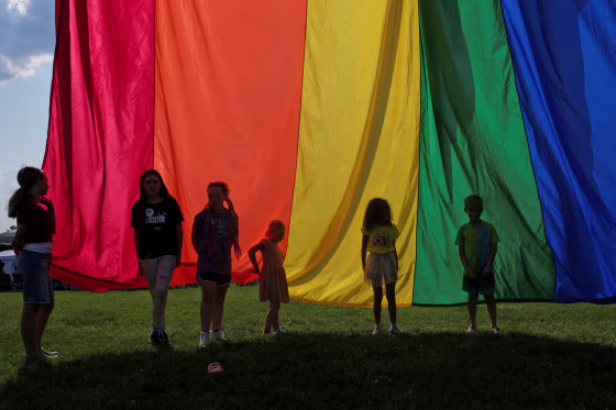 Children hold the rainbow flag during an LGBTQ Pride event in Franklin, Tenn., on June 3, 2023.