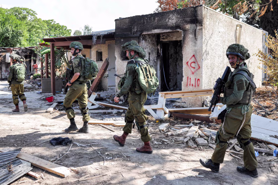 Israeli soldiers patrol near the Gaza Stripin kibbutz Kfar Aza, Israel