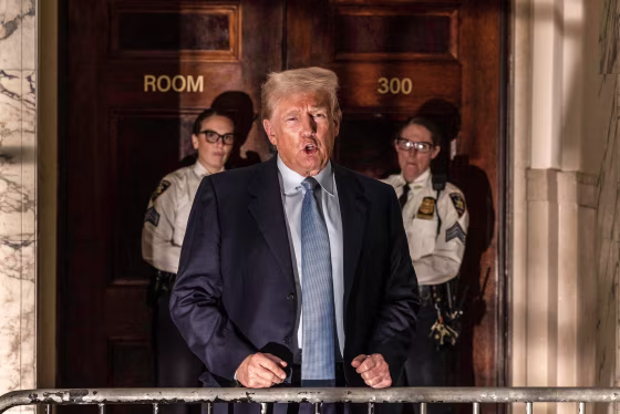 Image: Former president Donald Trump addresses the media before leaving the courthouse