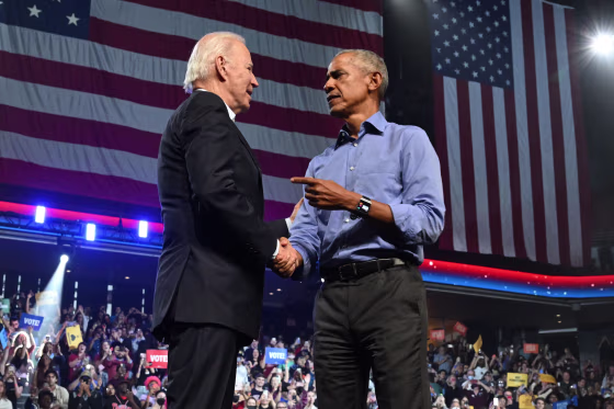 President Joe Biden and former President Barack Obama shake hands onstage at a midterms campaign rally in Pennsylvania