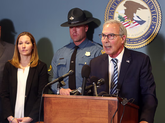 David Weiss, U.S. Attorney for the State of Delaware (right), speaks at a press conference on February 21, 2023 about an effort