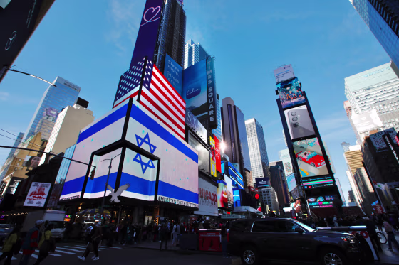 Image: Screens display the American and Israeli flags in Times Square on Oct. 13.