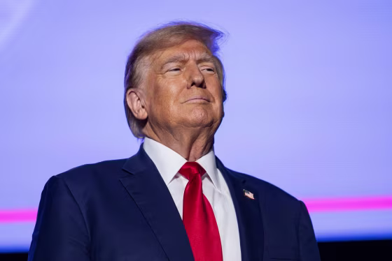 Former President Donald Trump arrives at a campaign event