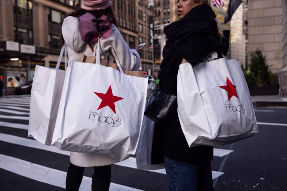 Shoppers carry Macy's bags during "Black Friday" in New York