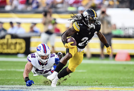 Anthony McFarland Jr. #26 of the Pittsburgh Steelers avoids a tackle by A.J. Klein #52 of the Buffalo Bills in Pittsburgh, Pa. on Aug. 19, 2023. 