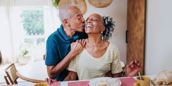 a man kissing a woman on the cheek for valentine's day