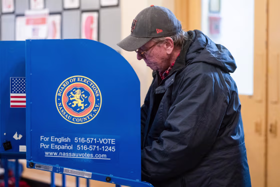 A voter casts a ballot at a polling station
