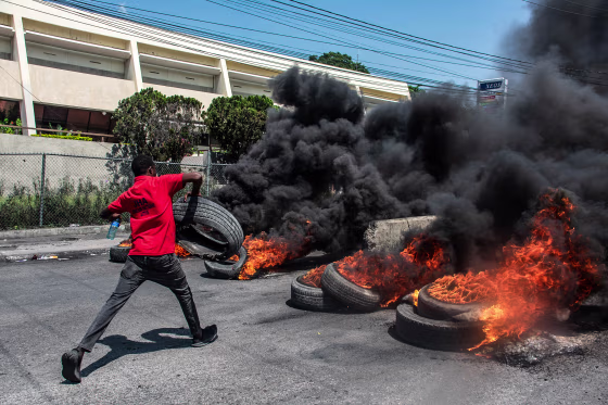 A protester burns tires during a demonstration