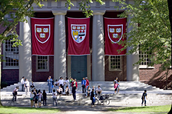 Harvard banners outside Memorial Church on the Harvard University campus in Cambridge, Mass.