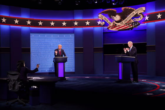 Donald Trump and Joe Biden talk to the moderator