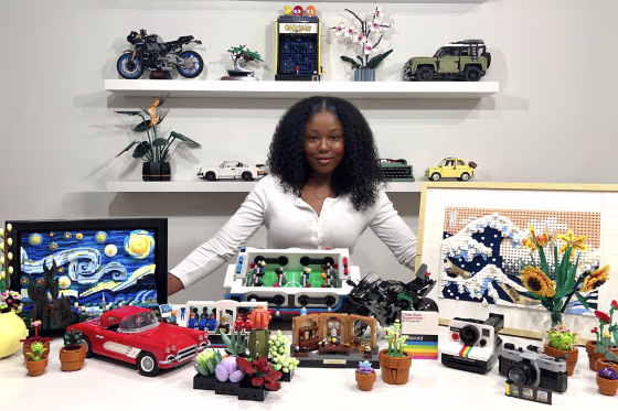 Alyssa Evans, 23, in front of her massive Lego set collection.