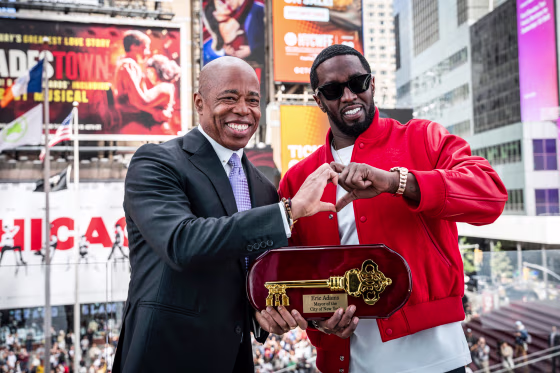 Eric Adams, left, presenting the Key to the City to hip-hop artist Sean "Diddy" Combs in Times Square