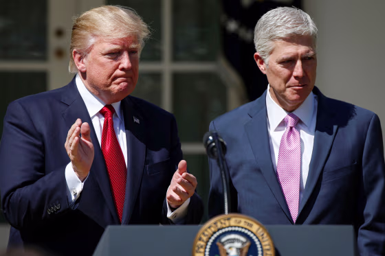 Donald Trump applauds Judge Neil Gorsuch.