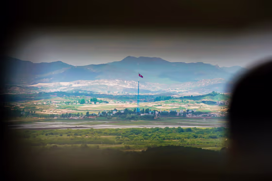 A visitor observes the Korean border from an observatory inside the Demilitarized Zone on May 18.