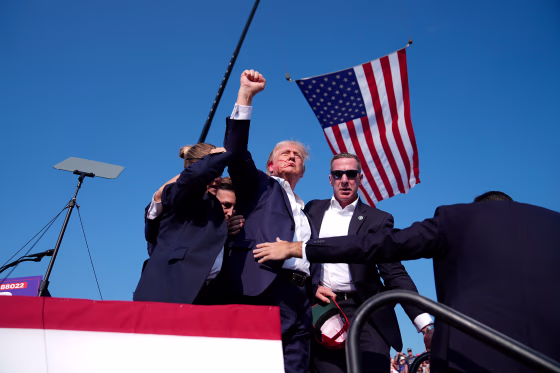 Donald Trump leaves the stage after having been shot at a campaign rally in Butler, Pa., on July 13.