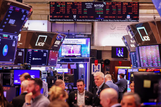 Traders work on the floor of the New York Stock Exchange.