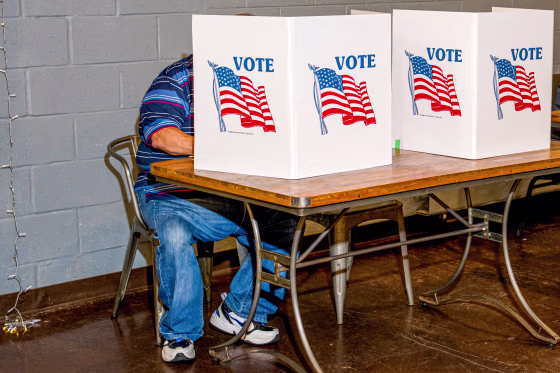 A voter fills out their ballot.