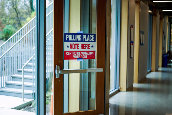 A door with a 'polling place' sign.