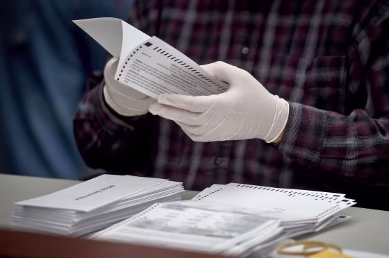 County employee opens mail-in ballots