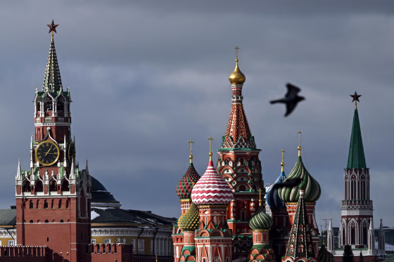 The Kremlin's Spasskaya tower, left, and Saint Basil's cathedral in Moscow.